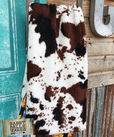 Get Cozy: Shop Cow Print Sherpa Blankets Now!